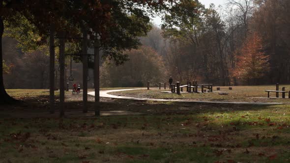 Exercise Course and Bike Path with walker - Rock Creek Park - Washington, DC - Autumn alt