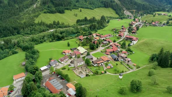 Scenic Aerial View of Mountain Village in Alpine Countryside in Bavaria, Germany
