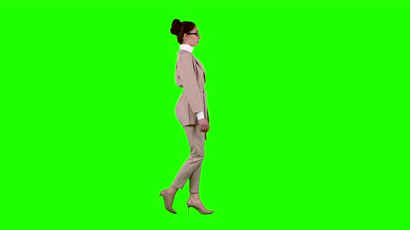 Businesswoman Flirting Correcting Glasses. Green Screen. Side View. Slow Motion alt