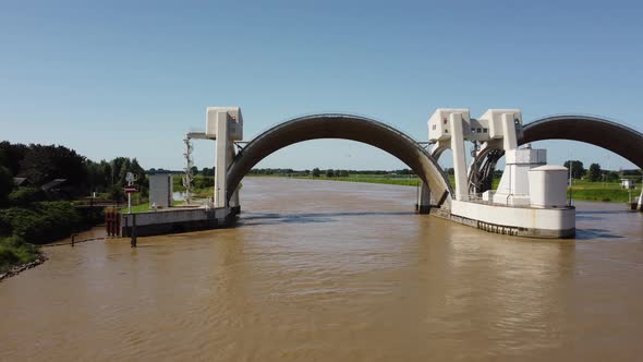 Lock and weir In Dutch River Lek Called Sluice Hagestein, aerial alt