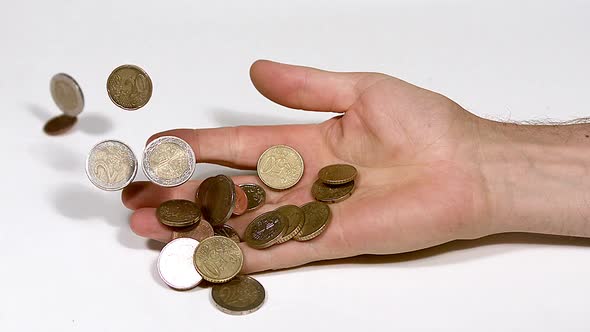 700368 Hand of Man Falling with Euro Coins against White Background, Slow Motion alt