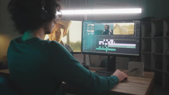 Male Freelancer Editing Video at Night alt