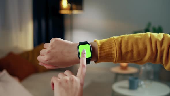 Woman Using Smartwatch with Chroma Key Closeup alt