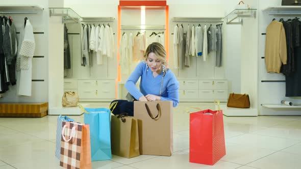 Sale Sign in Pretty Female Hands