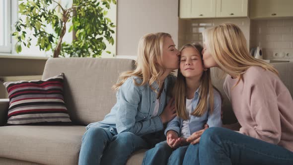 Little Cute Girl Her Attractive Young Mother and Charming Grandmother are Spending Time Together at alt