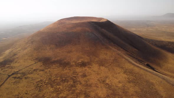 Drone Rising Above Volcano on Planet Mars