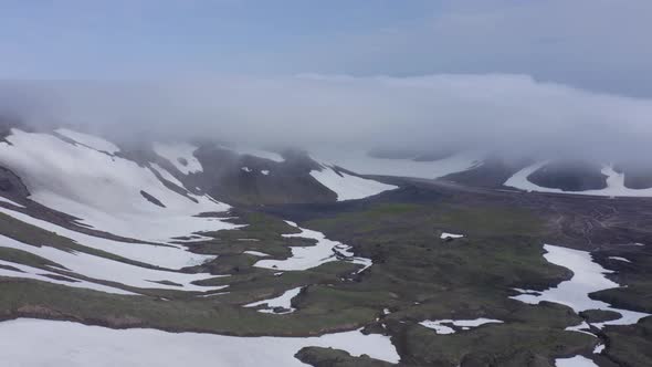 The Magma Stone Field of Gorely Volcano Covered with Fog