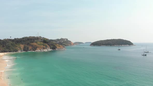 View to Promthep Cape from Tropical golden sandy Nai harn beach, in Phuket, Thailand alt
