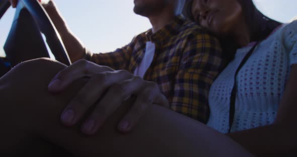 Young couple on a road trip in their pick-up truck alt