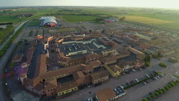 Aerial view of Mantova outlet village, shopping tour to Italy, brands and trends alt