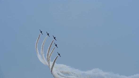 Five Exhibition Aircrafts Are Flying and Do Smoke Stunts and Drawing at Air Show alt