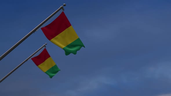 Guinea Flags In The Blue Sky - 2K