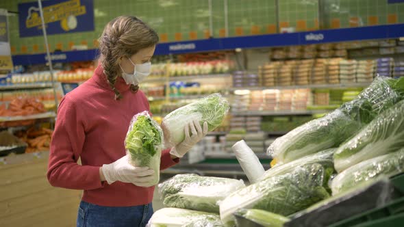 Girl in Mask and Gloves Chooses Fresh Cabbage Vegetables in Supermarket, Quarantine Coronavirus alt
