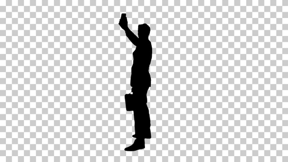 Silhouette Young business man walking and taking a selfie alt