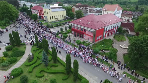 Aerial view of people in traditional clothes alt
