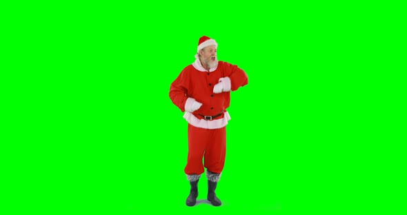 Santa claus dancing against green background alt