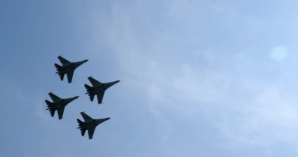 Flight of Su-35 Planes Through Best of Sun at Air Show Is Exciting and Extreme alt