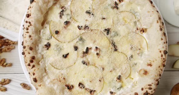 Big Pizza with 4 cheese with Pear Ready for Eating. Delicious Italian Pizza. alt