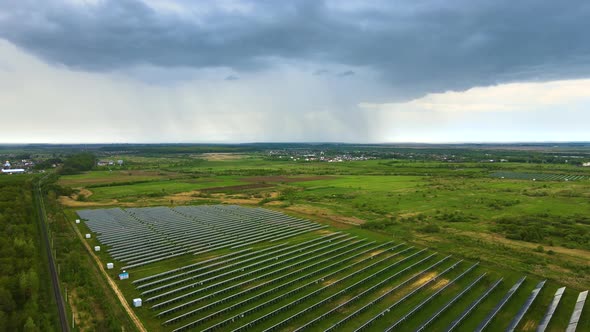Aerial View of Big Sustainable Electric Power Plant with Many Rows of Solar Photovoltaic Panels for alt