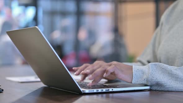 Side View of Female Hands Typing on Laptop alt