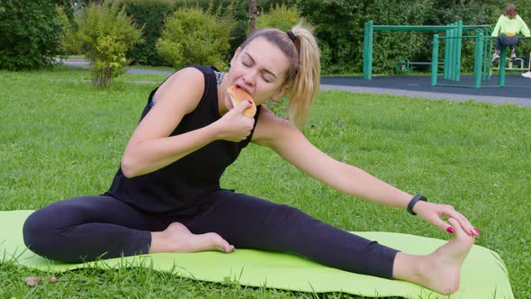 Girl Stretches on Exercise Mat and Bites Off Pie alt