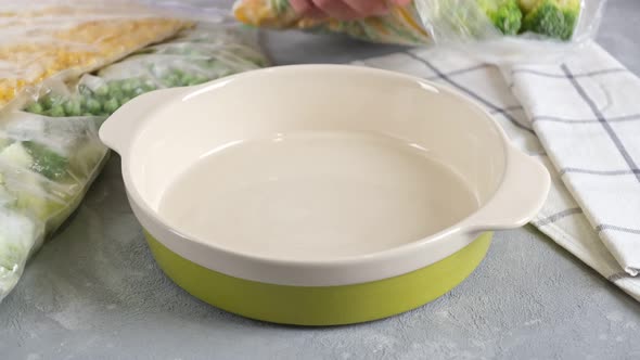 Frozen vegetables in a baking dish. Frozen food.