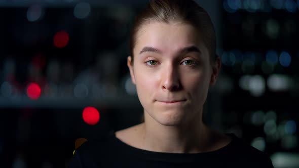 Portrait of Charming Girl Shrugging Shoulders Indoors alt