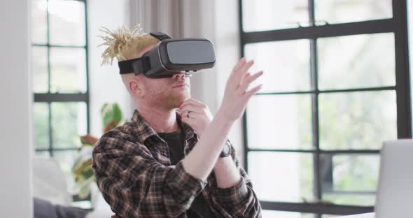 Albino african american man with dreadlocks using vr headset alt