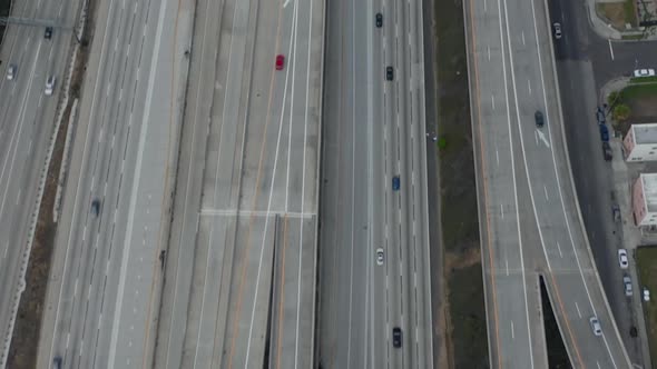 AERIAL: Slow Overhead Lookup Over 110 Highway with Little Car Traffic in Los Angeles, California on alt
