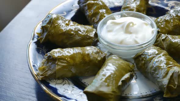 Delicious Dolma with the Cream Sauce on a Asian Plate