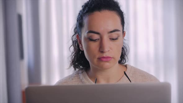 Portrait Caring Caucasian Female Freelancer Putting on Glasses Before Starting To Work on a Laptop alt