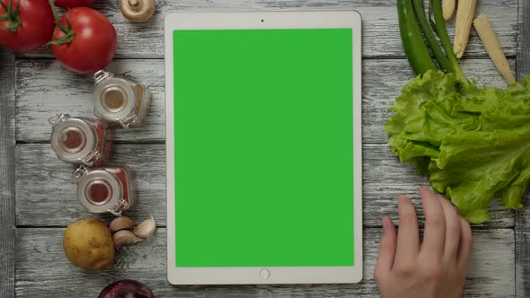 Unrecognizable Person Examining Swipes with His Fingers Near Digital Pad alt