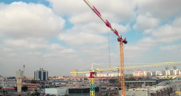 Working Cranes in the city, Building in the Process of Construction.