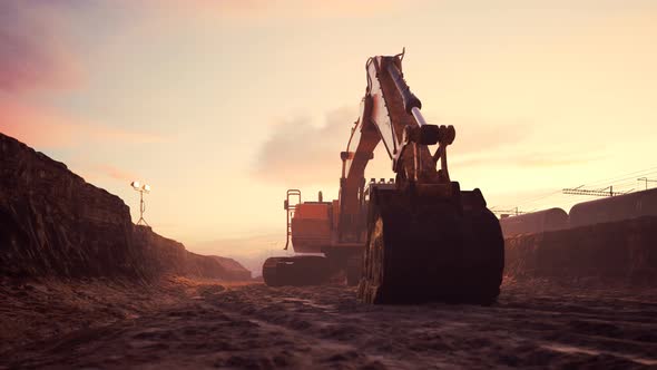 Excavator or digger at construction Site during sunset. Heavy industry. 4k HD alt