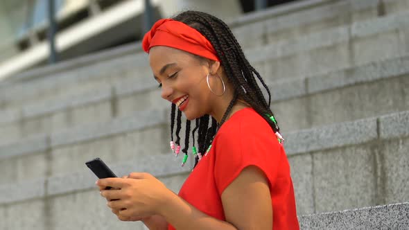 Smiling African-American Teen Girl Chatting With Friends in Social Network, Fun alt