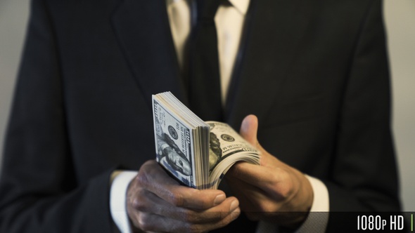 Businessman Holding and Counting American $100 Dollar Banknotes for Money and Financial Concept alt