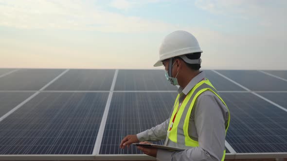 Engineers Working To Power Solar Panel Renewable Power Plants In Thailand. alt
