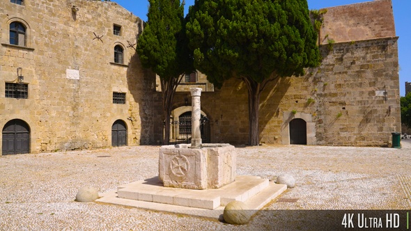 4K Panning around medieval old town of Rhodes marble fountain, Greece alt