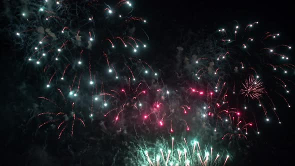Colorful Firework display at night on sky background alt