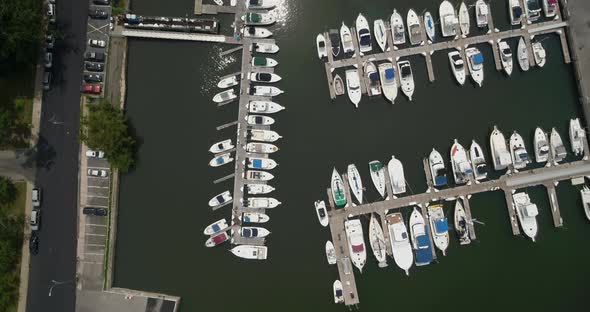 Top Down Aerial Panning of Boats Docked at a Marina alt