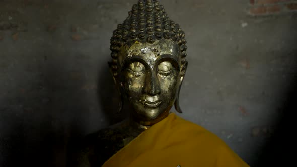 Buddha Statues Draped in Yellow at Wat Yai Chai Mongkhon in Ayutthaya Thailand  Pushback Shot alt