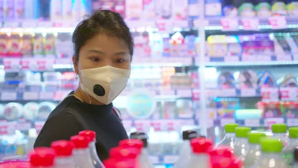 New normal after covid epidemic young smart asian female shopping new lifestyle in supermarket alt
