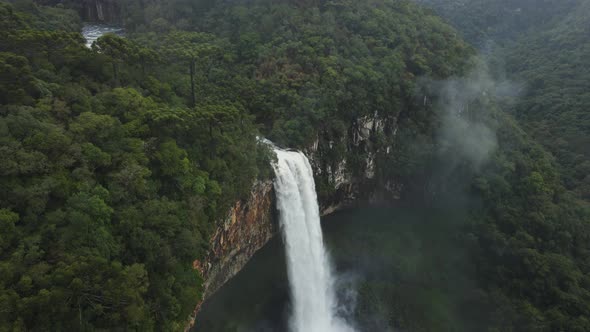 Beautiful Waterfall Among Lush Dense Greenery