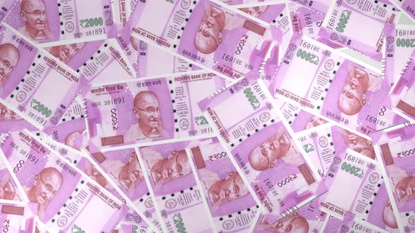 2000 Indian Rupee bills background. Many banknotes. alt