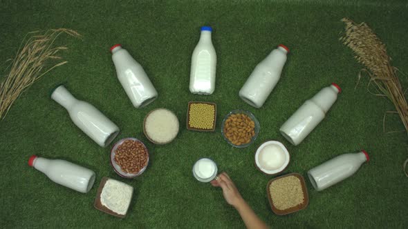 Different Types of Milk on Grass