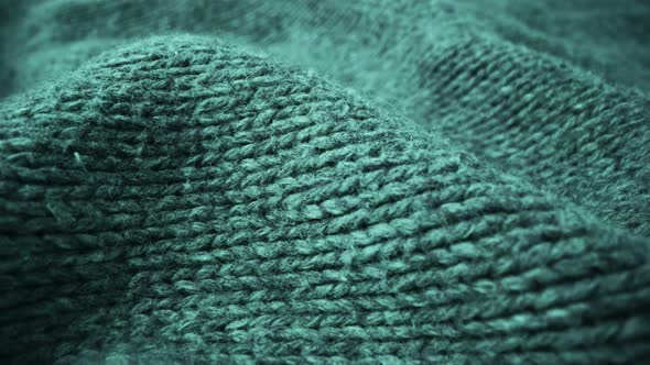 Extreme detail view of sheep wool cloth texture flowing in macro dolly shot. alt