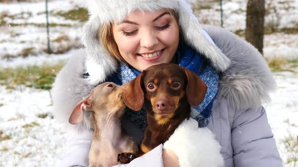 Woman with Dogs Outside in Winter