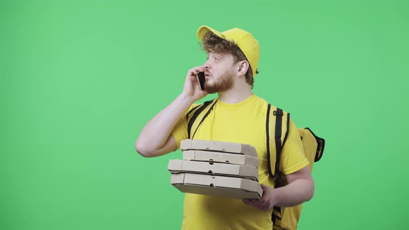 Portrait of Young Men Talking on Phone Drops Pizza Boxes and is Very Upset alt