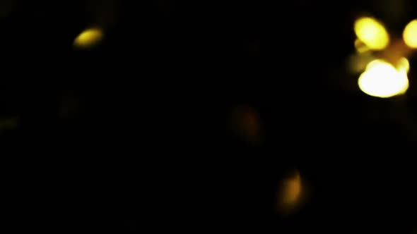 Golden Christmas Tree Particles Flying After Being Exploded, Bright Confetti Bouncing on Black alt