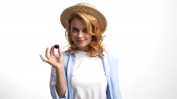 Sexy Woman in Straw Summer Hat Eat Fresh Ripe Sweet Cherry Berry Temptation